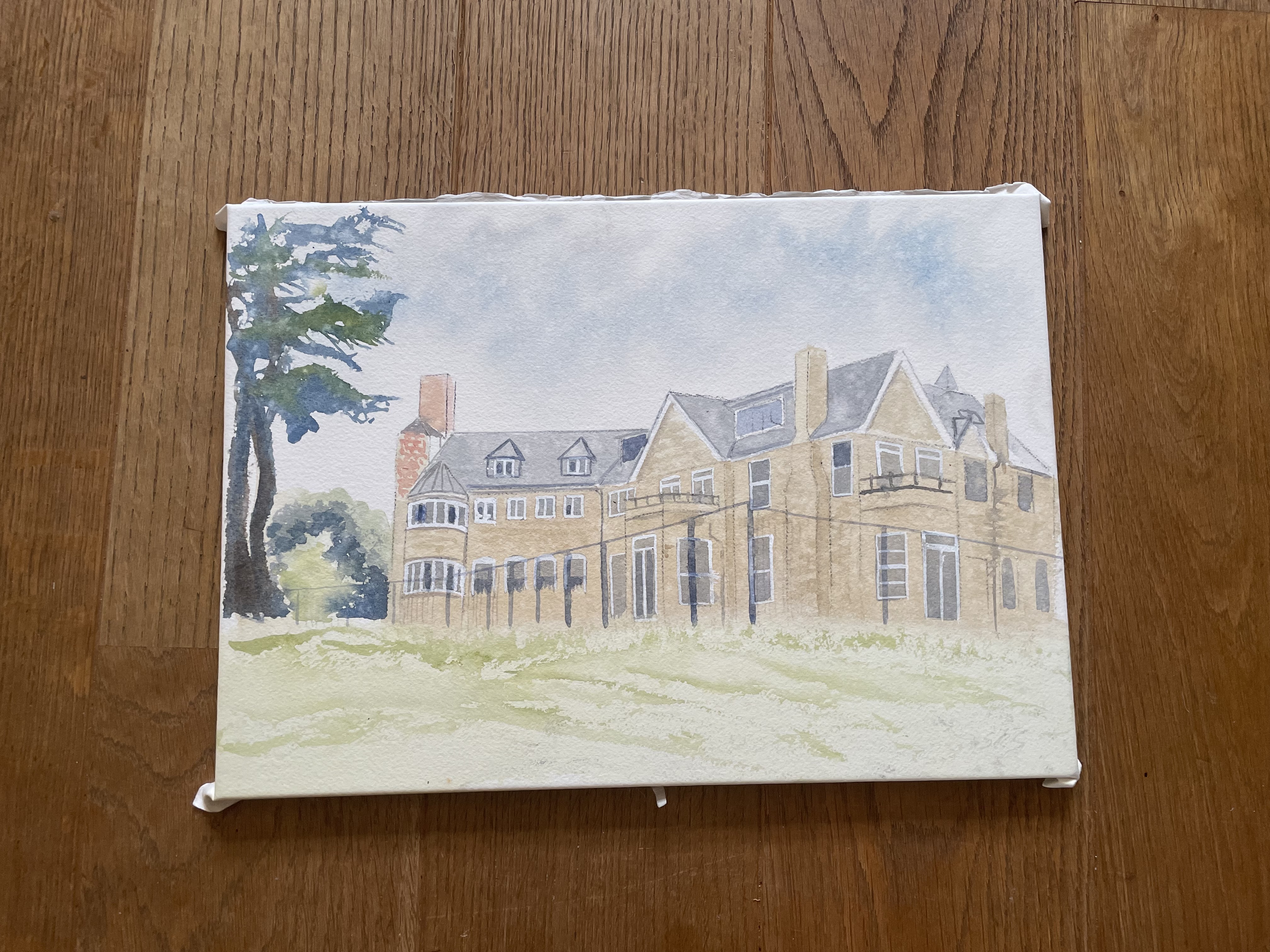 Muted watercolour showing the elevation of a 3 story brick mansion style house from the back. A wing projects to the left with a chequered chimney side on, rotunda windows and two gable windows in the eves. A cedar of lebanon stands to the left