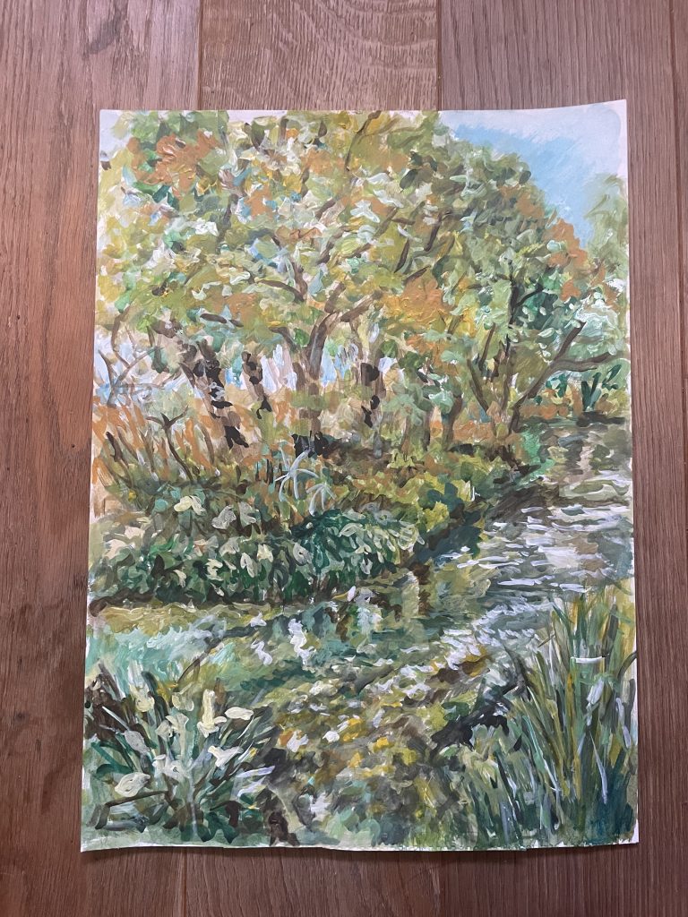 Autumnal trees line the river bank as it follows the water round a curve. A willow heels over into the stream far right. A sense of the season's turn.